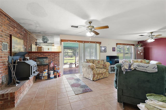 living room with light tile patterned floors, a wealth of natural light, and ceiling fan