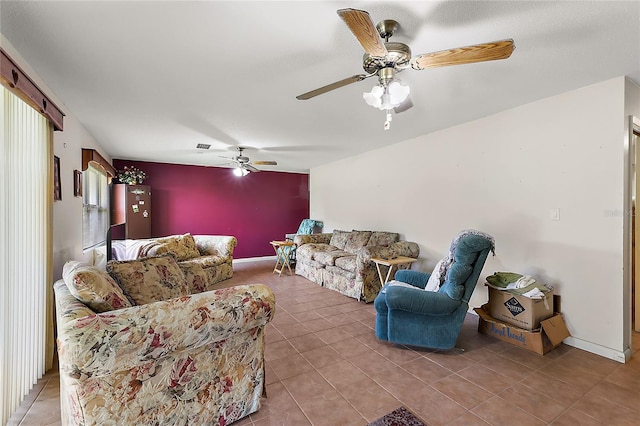 tiled living room with ceiling fan