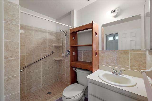 bathroom featuring toilet, tasteful backsplash, vanity, and a tile shower