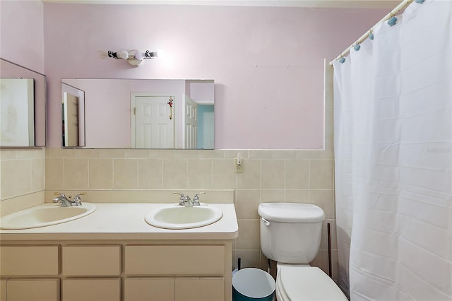 bathroom with vanity, toilet, tile walls, and a shower with shower curtain