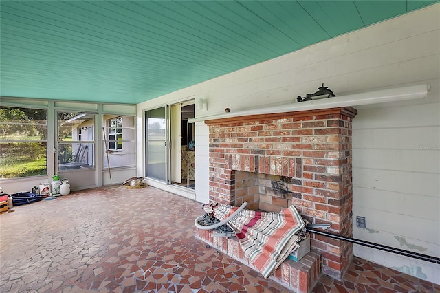 interior space with a brick fireplace