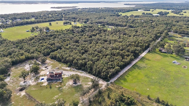 drone / aerial view featuring a rural view and a water view