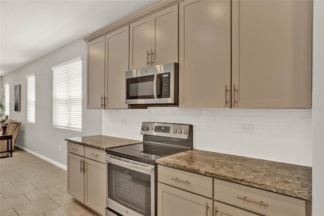 kitchen with tasteful backsplash, stainless steel appliances, and stone countertops