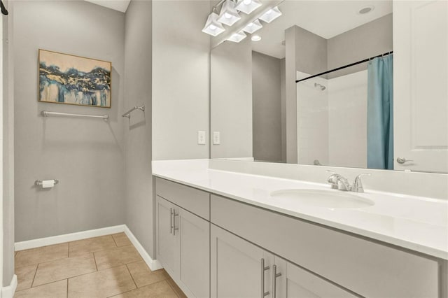 bathroom featuring vanity, tile patterned flooring, and a shower with shower curtain