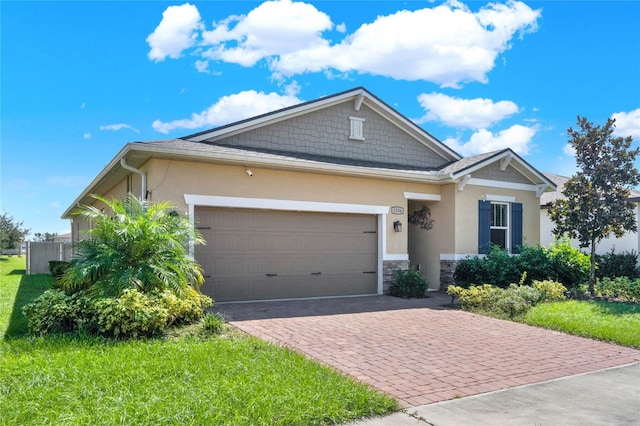 view of front of house with a garage and a front lawn