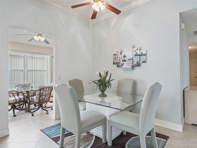 dining room featuring ornamental molding, ceiling fan, and light tile patterned floors