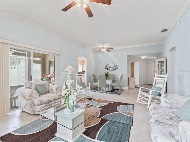 living room featuring crown molding, a textured ceiling, and ceiling fan