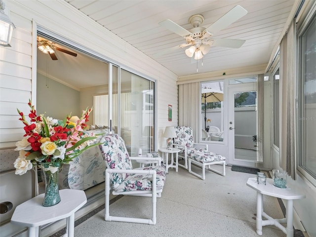 sunroom / solarium with ceiling fan