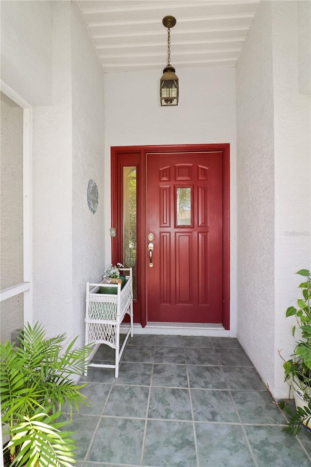 entrance to property featuring a porch