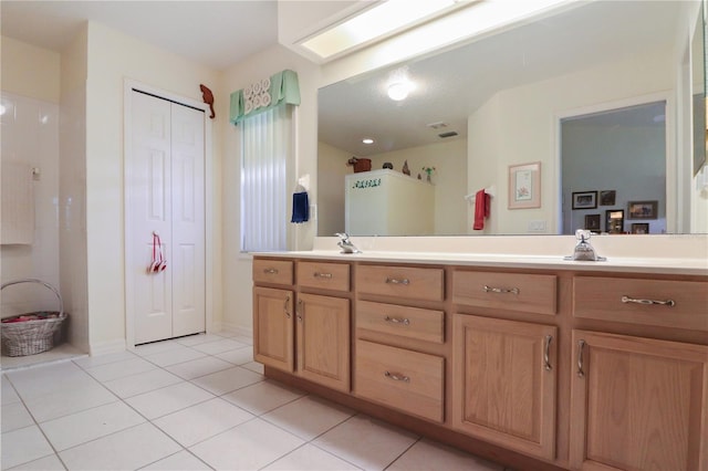 bathroom with vanity and tile patterned flooring