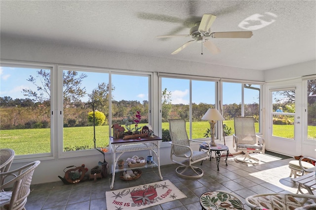 sunroom / solarium with ceiling fan