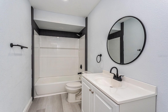 full bathroom featuring vanity, toilet, hardwood / wood-style floors, and shower / bathtub combination