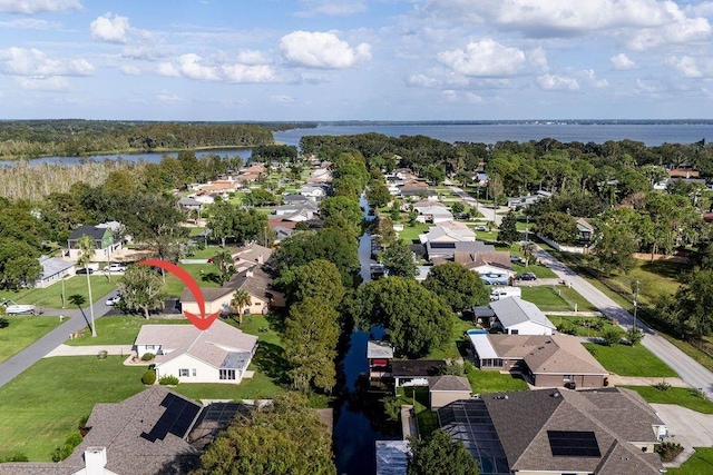 drone / aerial view with a water view