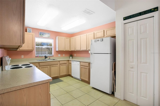 kitchen with light brown cabinetry, white appliances, light tile patterned floors, and sink