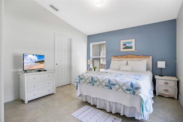 tiled bedroom with vaulted ceiling