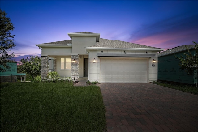 1180 Dora Parc Ln, Mount Dora, FL 32757 - prairie-style home with decorative driveway, an attached garage, stucco siding, stone siding, and a yard