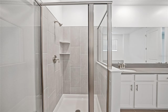 bathroom with vanity and walk in shower