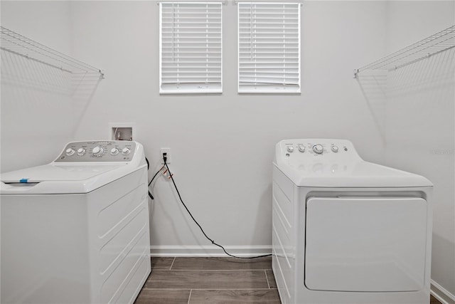1180 Dora Parc Ln, Mount Dora, FL 32757 - washroom featuring separate washer and dryer, baseboards, and dark wood finished floors