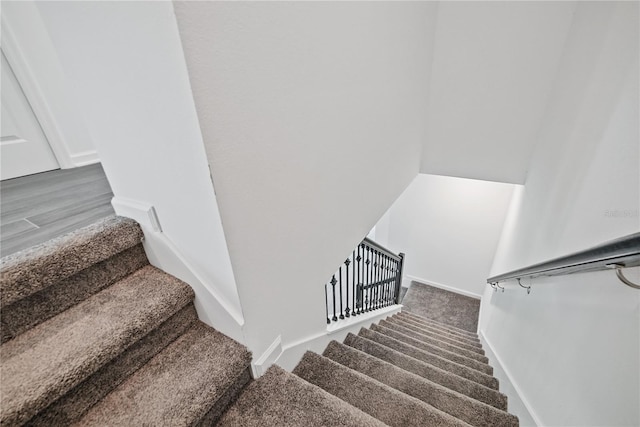 stairs with hardwood / wood-style flooring