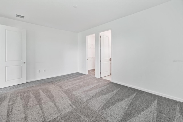 spare room featuring carpet