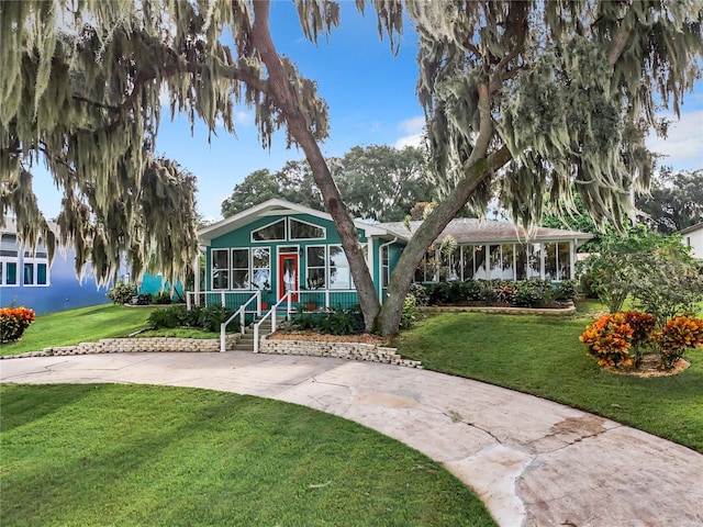 view of front of house featuring a front yard and covered porch