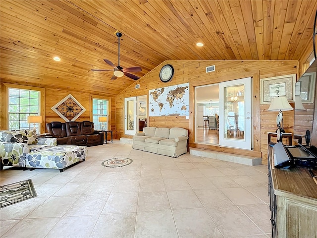 tiled living room with lofted ceiling, wooden walls, wooden ceiling, and ceiling fan