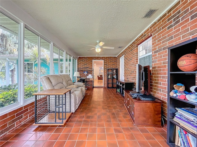 sunroom / solarium with ceiling fan