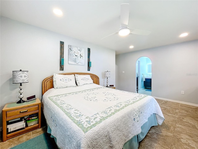 bedroom with connected bathroom and ceiling fan