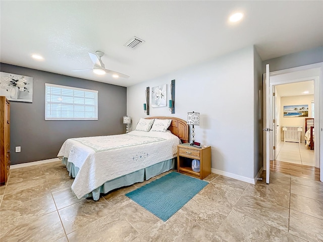 bedroom featuring ceiling fan and radiator heating unit