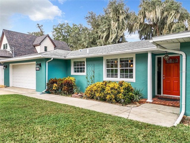 ranch-style home with a front yard and a garage