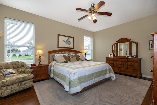 bedroom featuring dark hardwood / wood-style flooring and ceiling fan