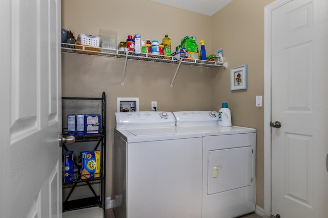 laundry area with separate washer and dryer