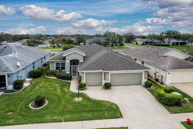 single story home with a front yard and a garage