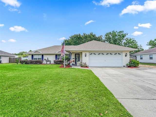 ranch-style home featuring a front lawn and a garage