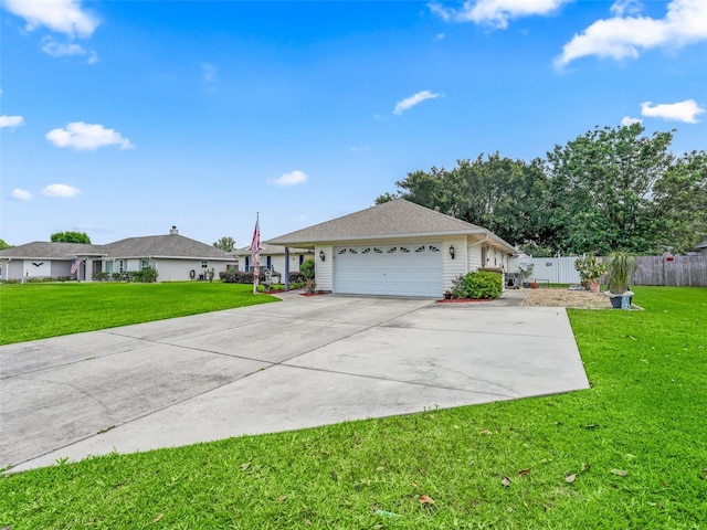 ranch-style home featuring a front lawn and a garage