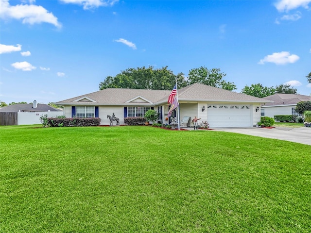 ranch-style house featuring a front lawn and a garage