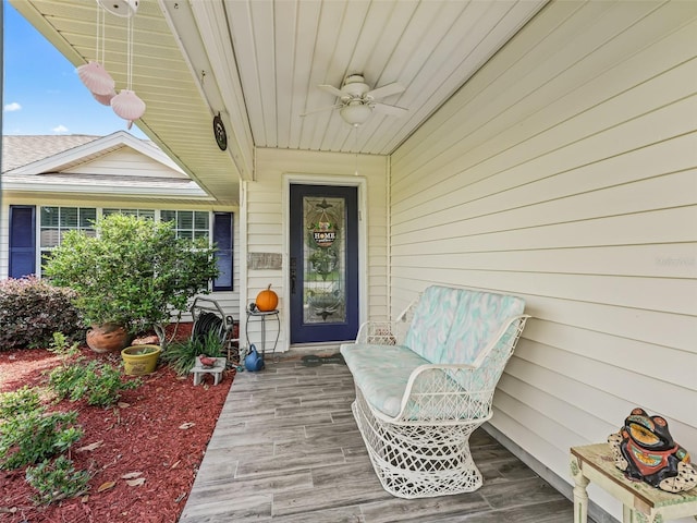 view of exterior entry featuring ceiling fan