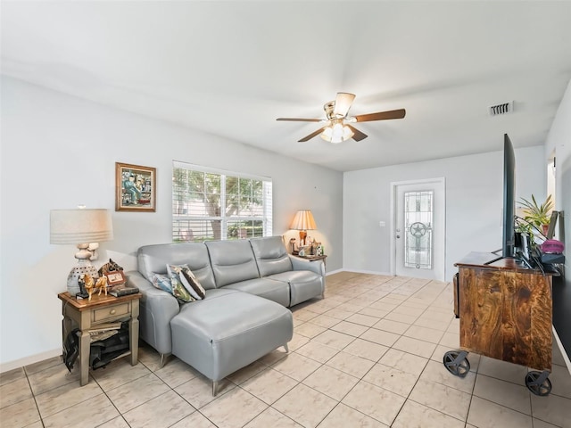 living room featuring ceiling fan and light tile patterned flooring