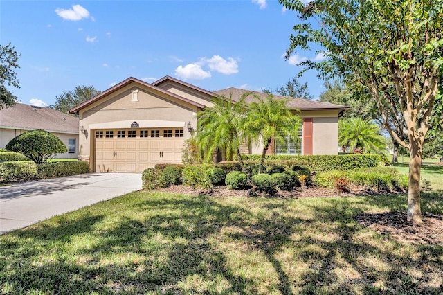 view of front of property featuring a front yard and a garage