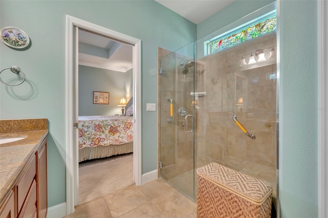 bathroom with vanity, ornamental molding, a shower with shower door, and tile patterned floors