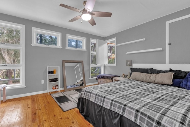 bedroom with hardwood / wood-style flooring and ceiling fan