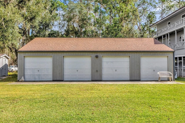 garage with a lawn