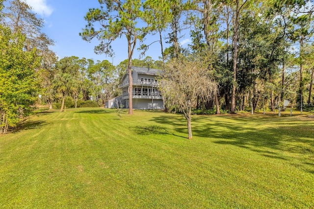 view of yard featuring a wooden deck