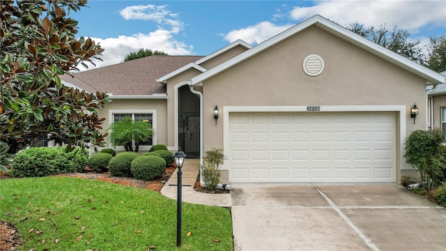 single story home with a front yard and a garage