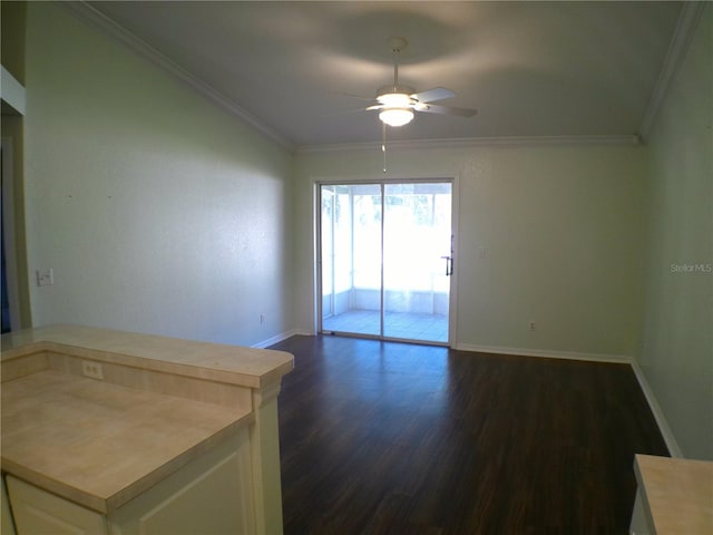 empty room featuring crown molding, dark hardwood / wood-style flooring, and ceiling fan