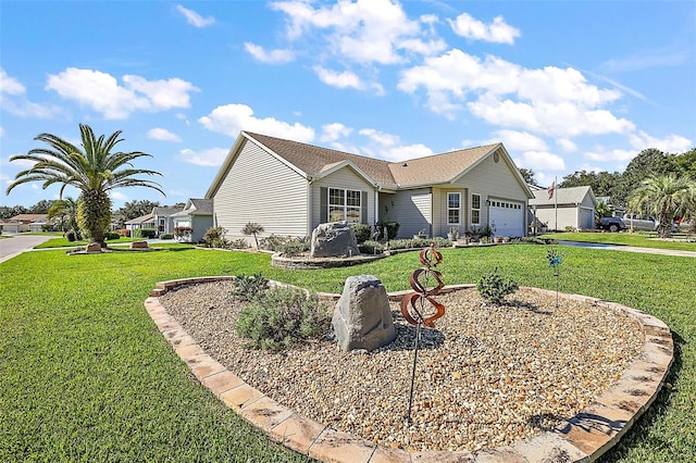 view of front facade with a front lawn and a garage