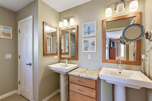 bathroom featuring double sink