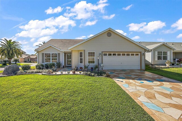 ranch-style home featuring a front yard and a garage