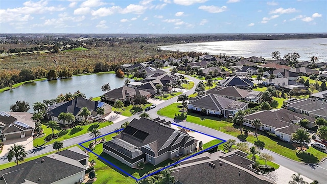 bird's eye view with a water view