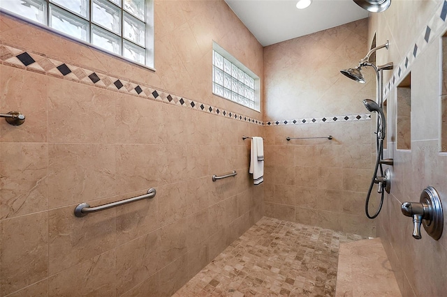 bathroom with tiled shower